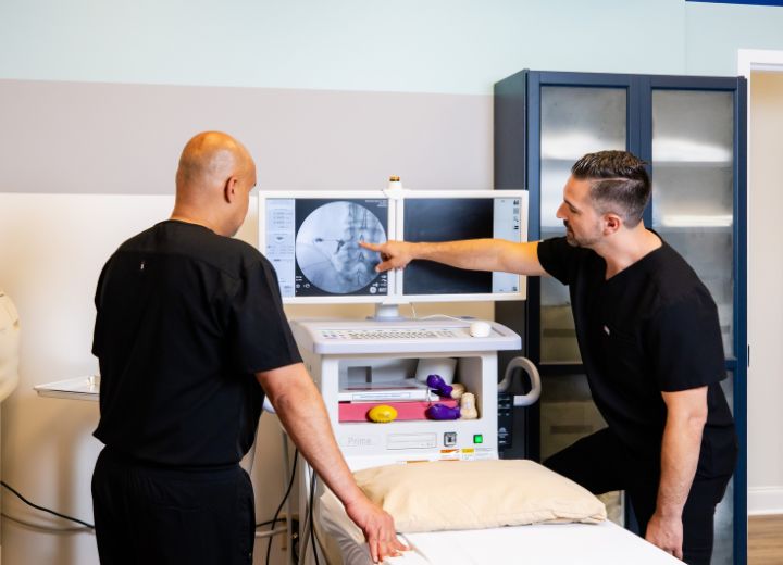 Physician performing a fluoroscopy-guided procedure at Advanced Sports and Spine